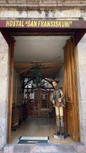 a statue of a man standing in a doorway at Hostal San Fransiskuni in Morelia