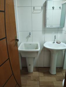 Et badeværelse på Apartamento Santos Avenida Praia + 6 billeder