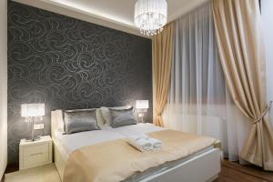 Posteľ alebo postele v izbe v ubytovaní VIP Apartamenty Gorące Źródła