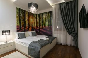 Posteľ alebo postele v izbe v ubytovaní VIP Apartamenty Gorące Źródła