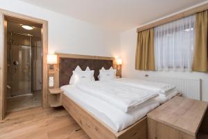 Postel nebo postele na pokoji v ubytování Appartement Landhaus KERSCHDORFER