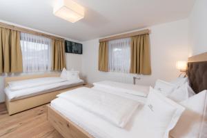 Postel nebo postele na pokoji v ubytování Appartement Landhaus KERSCHDORFER