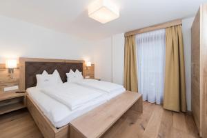 Postel nebo postele na pokoji v ubytování Appartement Landhaus KERSCHDORFER