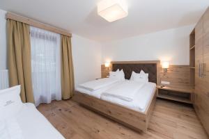 Postel nebo postele na pokoji v ubytování Appartement Landhaus KERSCHDORFER