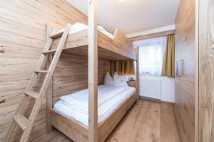 Postel nebo postele na pokoji v ubytování Appartement Landhaus KERSCHDORFER
