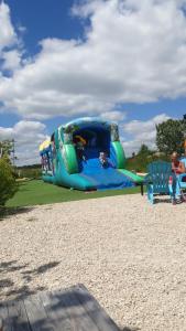 a blue inflatable bouncy house on the beach at Nat & Mayou in Onzain
