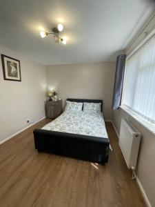 a bedroom with a bed in the middle of the room at 182 in Drayton