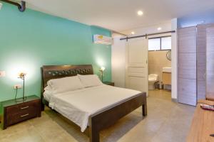 Ένα ή περισσότερα κρεβάτια σε δωμάτιο στο Moonshine Boutique Hostal