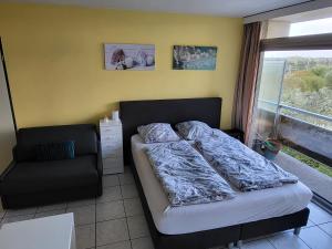 Postel nebo postele na pokoji v ubytování Studio Residentie Astrid