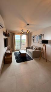 a living room with a couch and a table at Guesthouse Luxury in Cordoba