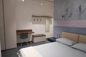 Postel nebo postele na pokoji v ubytování BLUMI Apartment