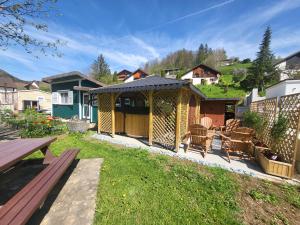 a gazebo in the yard of a house at Le Chalet Bed&Bath -Chez Les Alfreds in Soubey