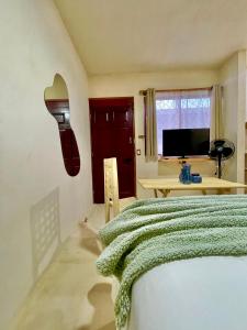 Postel nebo postele na pokoji v ubytování Hotel Casa Maakjä