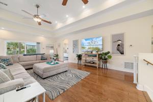 a living room with a couch and a table at The Yellow House North at Herons Walk in Pensacola