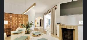 a living room with a fireplace and a tv at Casa Al Castello - Apartments Buccino in Buccino +4 photos