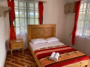 Postel nebo postele na pokoji v ubytování HotelSueños de Acapulco-Eje cafetero-Quindio