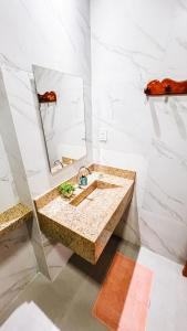 a bathroom with a sink and a mirror at Sunset Beach in Barra Grande +40 photos