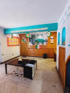 a dining room with a table in front of a restaurant at Hacienda del Indio in Mexicali
