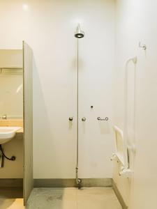 a shower stall in a bathroom with a sink at Bonaparte Hotel - Excelente Apartamento #503 in Brasilia +43 photos