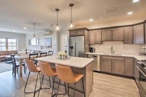 a kitchen with a table and chairs in a room at True Upscale Ski In & Out Condo with Pool & Hot Tub in Conway