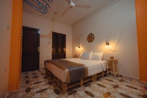 a bedroom with a large bed in a room at Wanees Hostel in Aswan