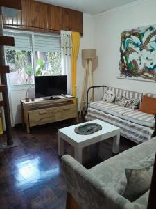a living room with a couch and a table at La Escondida in San Antonio de Areco