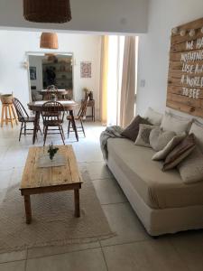 a living room with a couch and a table at Casa bohé Casilda in Casilda