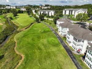an aerial view of a golf course with houses at Little House on the Fairway- Luxury Golf Condo in Branson