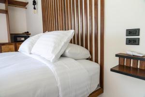 Ein Bett oder Betten in einem Zimmer der Unterkunft Mae Ya Resort