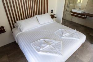 Ein Bett oder Betten in einem Zimmer der Unterkunft Mae Ya Resort