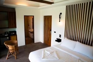 Ein Bett oder Betten in einem Zimmer der Unterkunft Mae Ya Resort