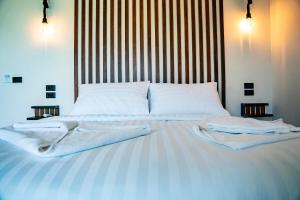 Ein Bett oder Betten in einem Zimmer der Unterkunft Mae Ya Resort