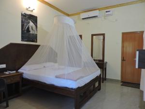 Postel nebo postele na pokoji v ubytování Abba's Glory Land - Agonda