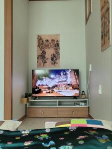 a living room with a flat screen tv on a wall at Hanyang Healing House - Foreigner Only in Seoul +13 photos