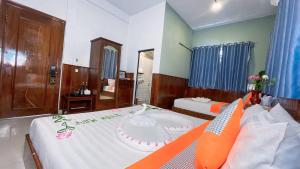 A bed or beds in a room at The Center Point