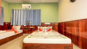 A bed or beds in a room at The Center Point