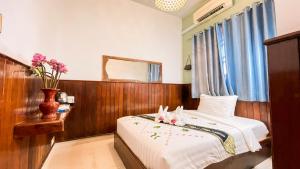 A bed or beds in a room at The Center Point