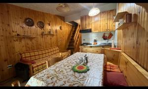 a kitchen with a table with a plate on it at GENZIANA in Cotronei