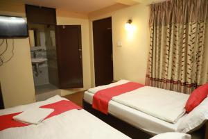 Voodi või voodid majutusasutuse HotelKTM toas