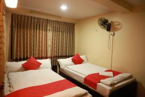 Voodi või voodid majutusasutuse HotelKTM toas