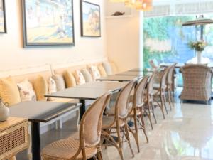 a row of tables and chairs in a restaurant at Hôtel de Provence in Cannes