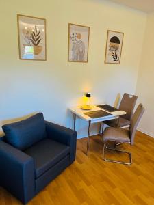 a living room with a couch and a table at Apartment tenX Mittweida in Mittweida