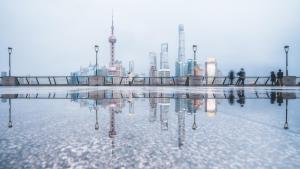 a reflection of a city skyline in a pool of water at Shanghai Atour Hotel On The Bund- People Square in Shanghai