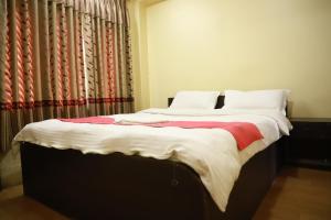 Voodi või voodid majutusasutuse HotelKTM toas