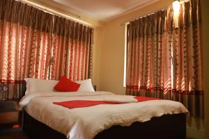 Voodi või voodid majutusasutuse HotelKTM toas