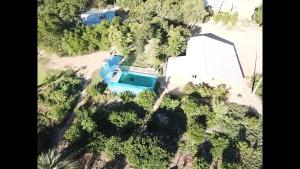 an aerial view of a house with a pool at Hotel Campestre Iparoma in Estancia Campo Aroma