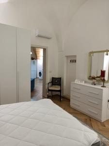A bed or beds in a room at La Casa Di Chia