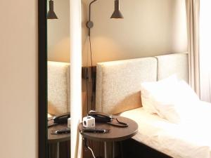 Postel nebo postele na pokoji v ubytování ibis Lille Centre Grand Place