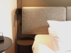 Postel nebo postele na pokoji v ubytování ibis Lille Centre Grand Place