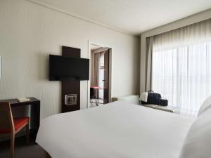 Postel nebo postele na pokoji v ubytování Novotel Athens